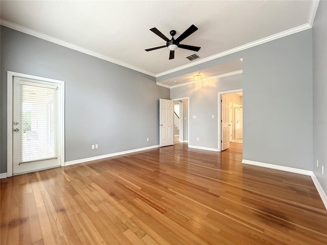 10915 Piping Rock Cir, Orlando, FL 32817 - unfurnished bedroom featuring baseboards, crown molding, a ceiling fan, light wood-style floors, and visible vents