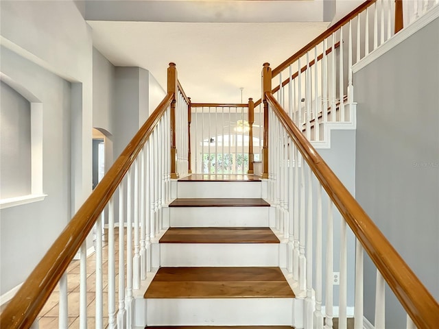10915 Piping Rock Cir, Orlando, FL 32817 - stairs with arched walkways