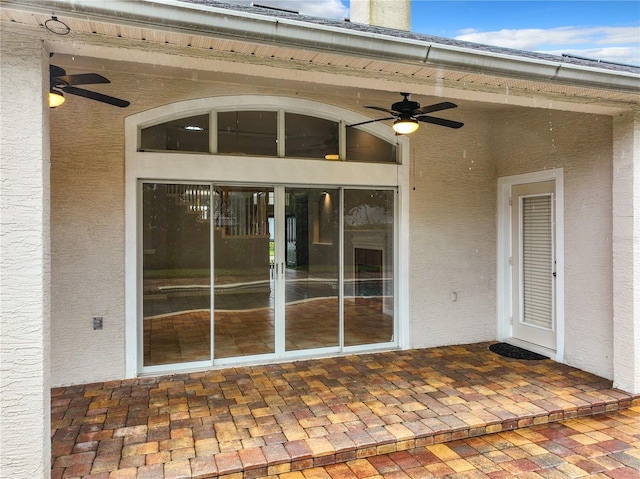 10915 Piping Rock Cir, Orlando, FL 32817 - entrance to property with stucco siding and ceiling fan