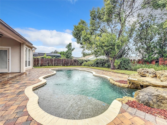 10915 Piping Rock Cir, Orlando, FL 32817 - view of swimming pool with a patio, a fenced backyard, and a fenced in pool