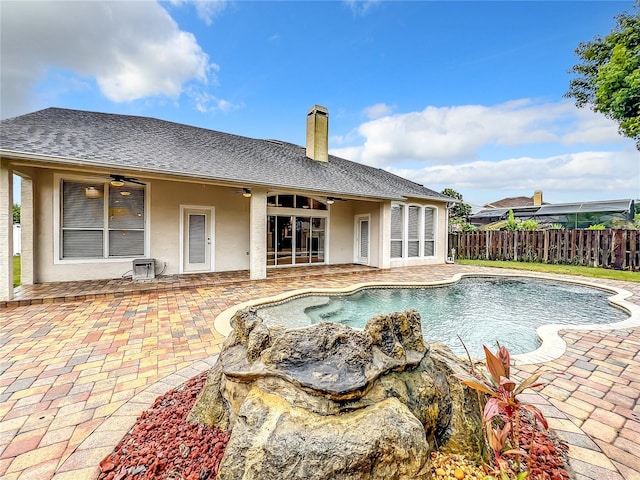 10915 Piping Rock Cir, Orlando, FL 32817 - view of pool with a ceiling fan, a patio area, a fenced in pool, and fence