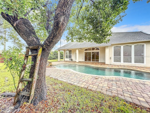 10915 Piping Rock Cir, Orlando, FL 32817 - outdoor pool featuring a patio area and ceiling fan