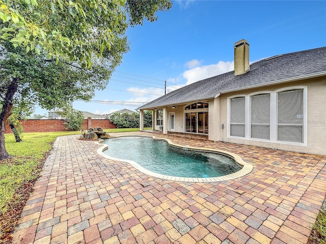 10915 Piping Rock Cir, Orlando, FL 32817 - view of pool with a fenced in pool, a patio, a fenced backyard, and a yard