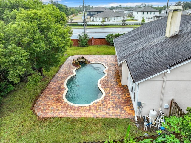 10915 Piping Rock Cir, Orlando, FL 32817 - outdoor pool featuring a yard, a patio, and a residential view