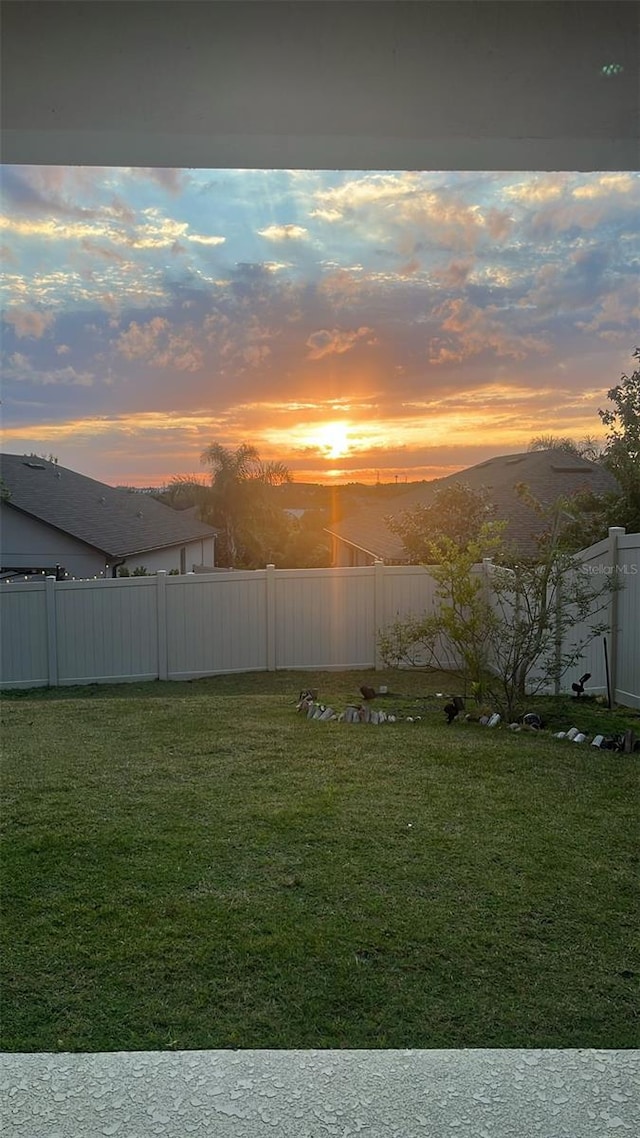 13323 Blossom Valley Dr, Clermont, FL 34711 - yard at dusk featuring fence