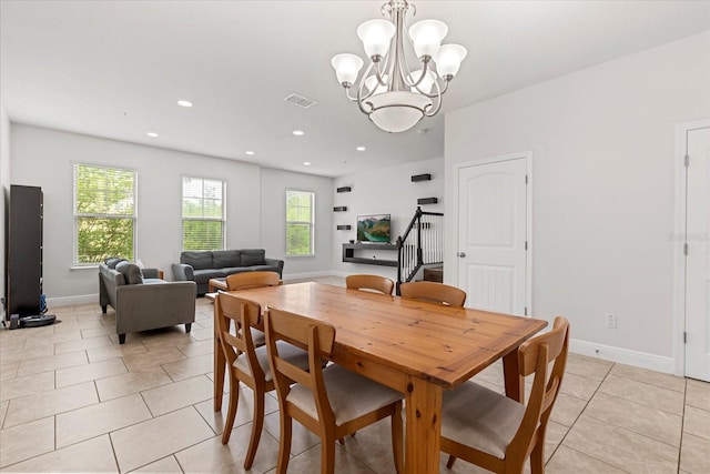 10866 Sunset Ridge Ln, Orlando, FL 32832 - dining area with light tile patterned floors, baseboards, recessed lighting, and an inviting chandelier
