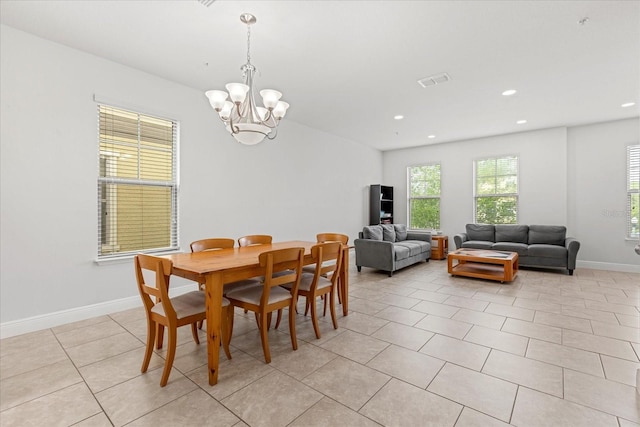 10866 Sunset Ridge Ln, Orlando, FL 32832 - dining room featuring baseboards, an inviting chandelier, recessed lighting, light tile patterned floors, and visible vents