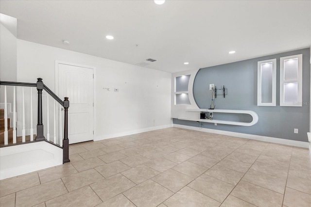 10866 Sunset Ridge Ln, Orlando, FL 32832 - spare room with baseboards, stairway, light tile patterned flooring, and recessed lighting