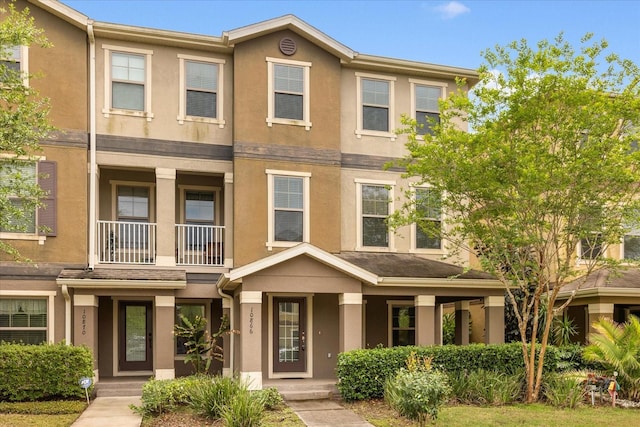 10866 Sunset Ridge Ln, Orlando, FL 32832 - view of property featuring stucco siding