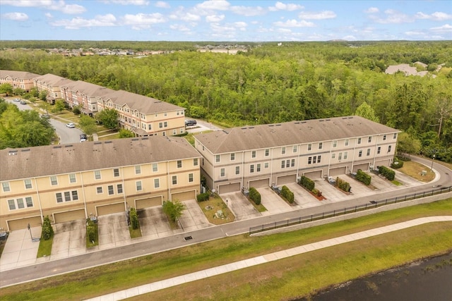 10866 Sunset Ridge Ln, Orlando, FL 32832 - bird's eye view with a wooded view and a residential view