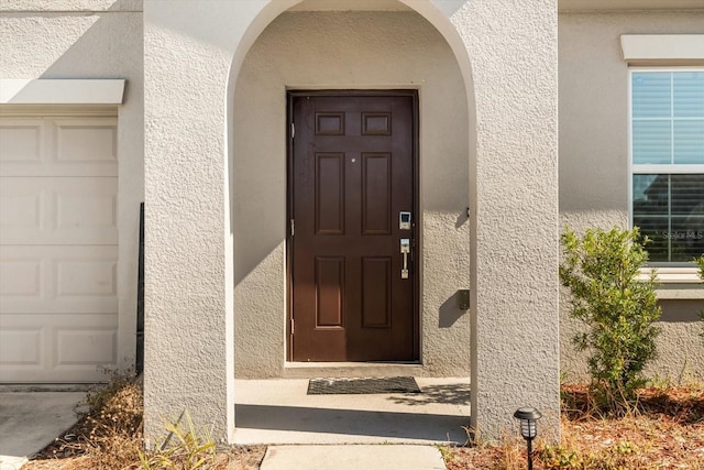 542 Patton Loop, Bartow, FL 33830 - entrance to property featuring stucco siding and a garage