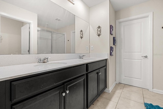 542 Patton Loop, Bartow, FL 33830 - full bath with a stall shower, double vanity, baseboards, and tile patterned flooring