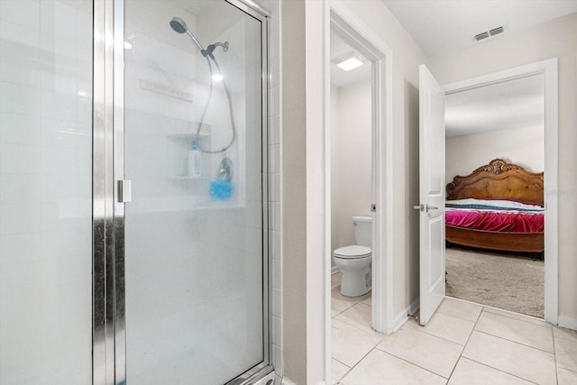 542 Patton Loop, Bartow, FL 33830 - bathroom featuring a shower stall, ensuite bathroom, toilet, and tile patterned flooring