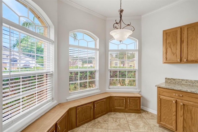 7762 Newlan Dr, Orlando, FL 32818 - unfurnished dining area featuring light tile patterned flooring, baseboards, and ornamental molding