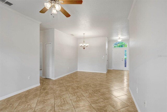 7762 Newlan Dr, Orlando, FL 32818 - spare room with crown molding, ceiling fan with notable chandelier, visible vents, light tile patterned flooring, and baseboards