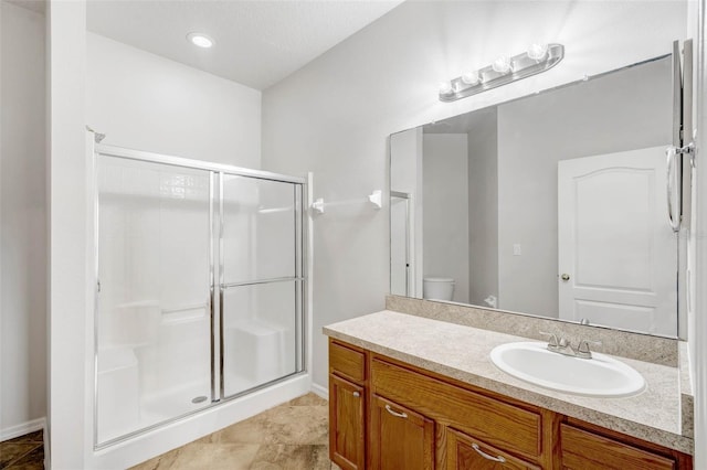 7762 Newlan Dr, Orlando, FL 32818 - bathroom with toilet, vanity, and a stall shower