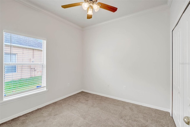 7762 Newlan Dr, Orlando, FL 32818 - carpeted empty room with baseboards, crown molding, and a ceiling fan