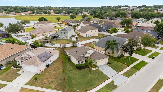 7762 Newlan Dr, Orlando, FL 32818 - drone / aerial view featuring a residential view and a water view