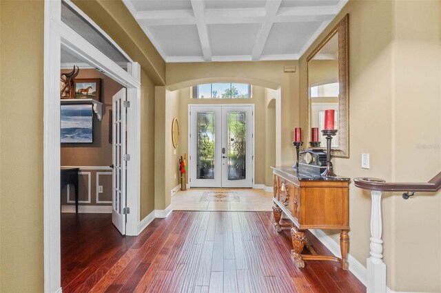 3583 Valleyview Dr, Kissimmee, FL 34746 - entryway with dark wood finished floors, arched walkways, coffered ceiling, beam ceiling, and french doors