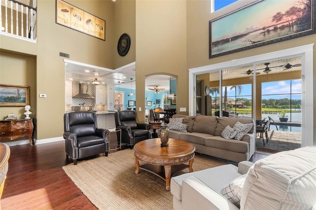 3583 Valleyview Dr, Kissimmee, FL 34746 - living room with a towering ceiling, wood finished floors, ceiling fan, and visible vents