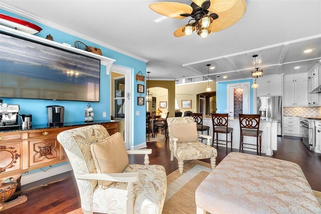 3583 Valleyview Dr, Kissimmee, FL 34746 - living room featuring ornamental molding, arched walkways, ceiling fan, and dark wood-type flooring