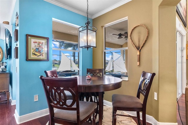 3583 Valleyview Dr, Kissimmee, FL 34746 - dining room featuring crown molding, a ceiling fan, wood finished floors, and baseboards