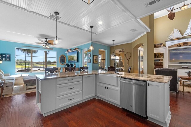 3583 Valleyview Dr, Kissimmee, FL 34746 - kitchen featuring light stone countertops, a ceiling fan, visible vents, stainless steel dishwasher, and open floor plan