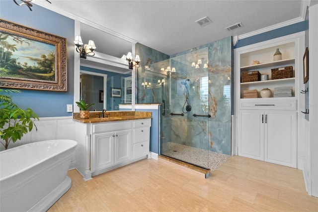 3583 Valleyview Dr, Kissimmee, FL 34746 - bathroom with visible vents, vanity, a freestanding bath, and a marble finish shower