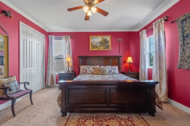 3583 Valleyview Dr, Kissimmee, FL 34746 - bedroom featuring a closet, ceiling fan, crown molding, light carpet, and baseboards