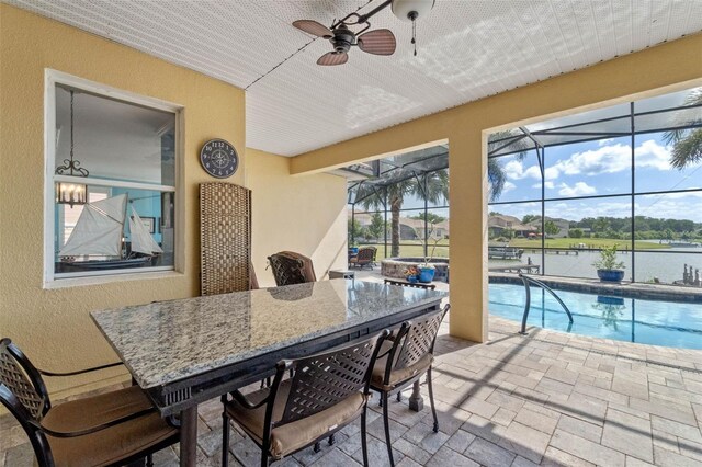 3583 Valleyview Dr, Kissimmee, FL 34746 - exterior space with a ceiling fan, a water view, a swimming pool, and outdoor dining area