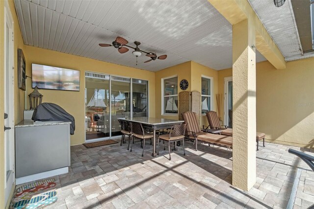 3583 Valleyview Dr, Kissimmee, FL 34746 - view of patio / terrace with outdoor dining space, ceiling fan, and an outdoor kitchen
