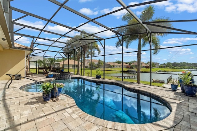 3583 Valleyview Dr, Kissimmee, FL 34746 - view of pool with a water view, a patio, glass enclosure, and a pool with connected hot tub