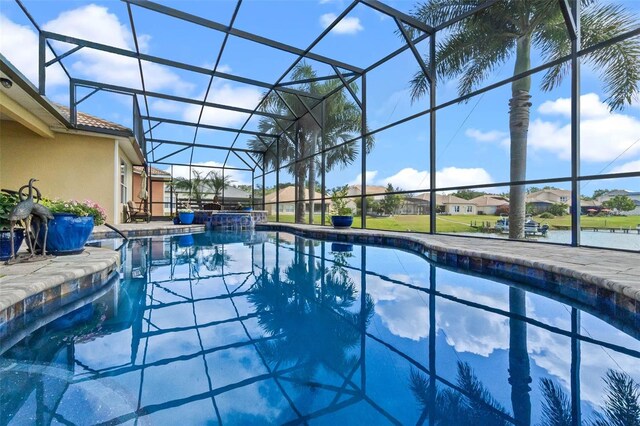 3583 Valleyview Dr, Kissimmee, FL 34746 - view of swimming pool featuring a lanai, a patio, a residential view, and a pool with connected hot tub