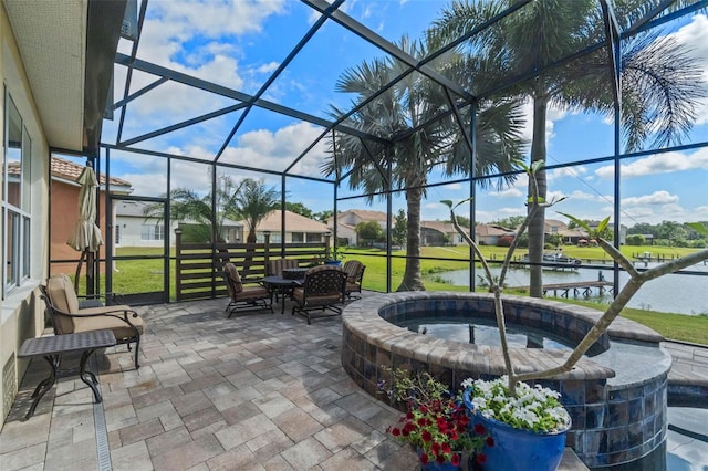 3583 Valleyview Dr, Kissimmee, FL 34746 - view of patio with an in ground hot tub, a residential view, a water view, glass enclosure, and outdoor dining space