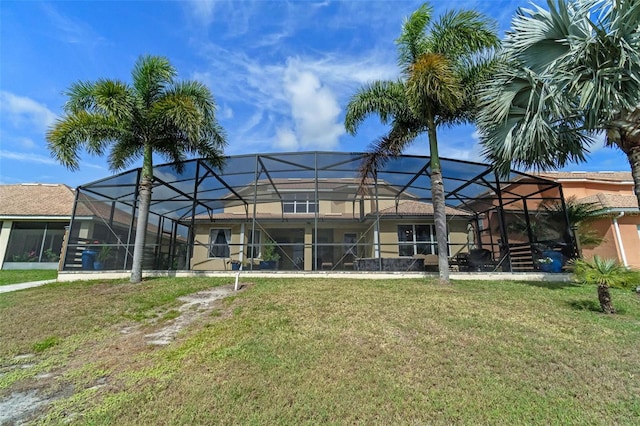 3583 Valleyview Dr, Kissimmee, FL 34746 - back of house featuring a lawn and stucco siding