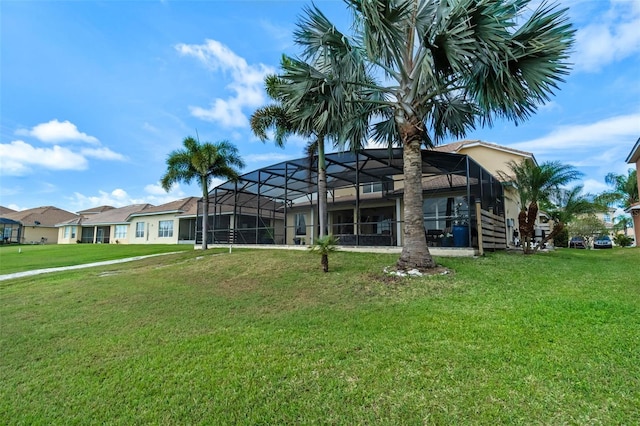 3583 Valleyview Dr, Kissimmee, FL 34746 - rear view of house featuring a lawn and glass enclosure