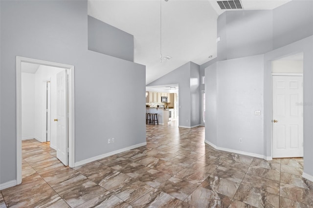 9301 Echo Run, Orlando, FL 32817 - spare room featuring high vaulted ceiling and baseboards