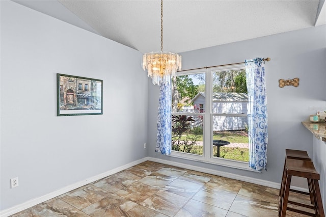9301 Echo Run, Orlando, FL 32817 - unfurnished dining area featuring a chandelier, baseboards, lofted ceiling, and a textured ceiling