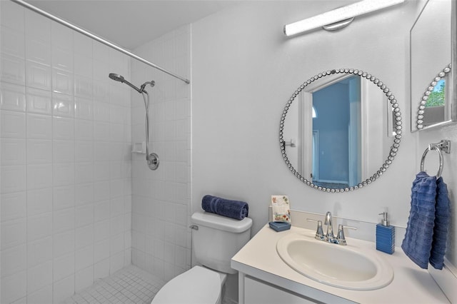 9301 Echo Run, Orlando, FL 32817 - bathroom with toilet, tiled shower, and vanity