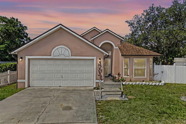 9301 Echo Run, Orlando, FL 32817 - view of front of house with concrete driveway, stucco siding, and an attached garage
