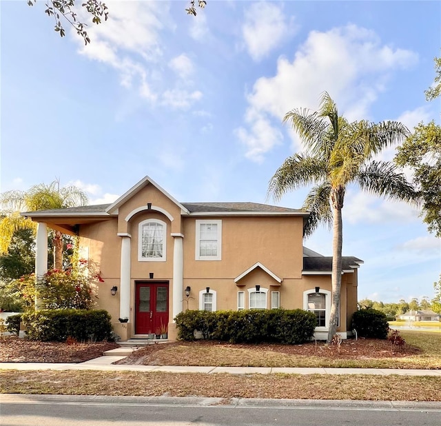 view of front of property with french doors and stucco siding