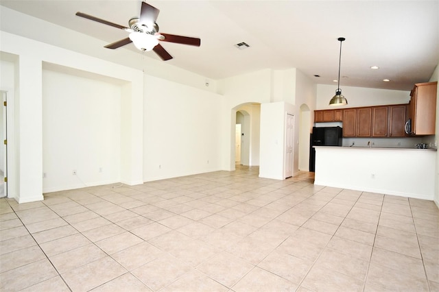 4626 Redmond Pl, Sanford, FL 32771 - unfurnished living room with light tile patterned floors, arched walkways, a ceiling fan, visible vents, and lofted ceiling