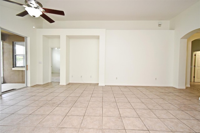 4626 Redmond Pl, Sanford, FL 32771 - unfurnished room with arched walkways, baseboards, light tile patterned flooring, and ceiling fan