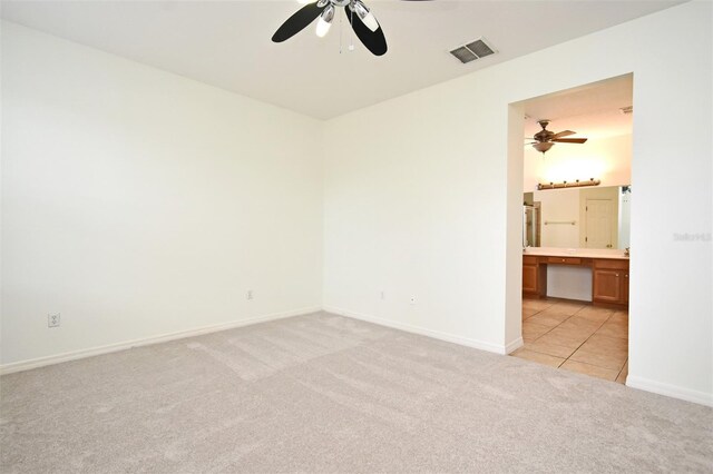 4626 Redmond Pl, Sanford, FL 32771 - spare room featuring light carpet, visible vents, baseboards, and ceiling fan