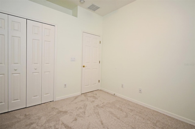 4626 Redmond Pl, Sanford, FL 32771 - unfurnished bedroom featuring a closet, baseboards, carpet, and visible vents