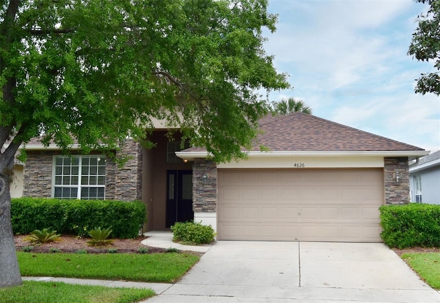 4626 Redmond Pl, Sanford, FL 32771 - single story home with stucco siding, stone siding, an attached garage, a shingled roof, and driveway
