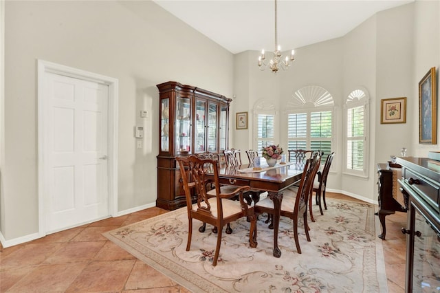 738 Powderhorn Cir, Lake Mary, FL 32746 - dining room featuring a chandelier, baseboards, and a high ceiling