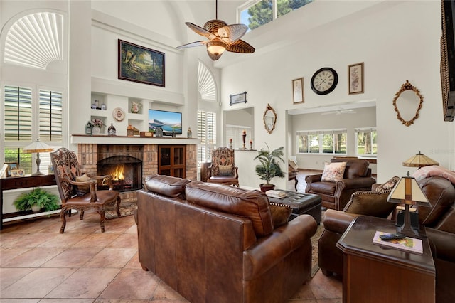 738 Powderhorn Cir, Lake Mary, FL 32746 - living area with a fireplace, a towering ceiling, built in features, and ceiling fan