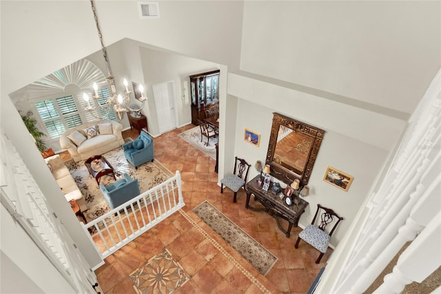 738 Powderhorn Cir, Lake Mary, FL 32746 - living area with an inviting chandelier, a towering ceiling, and visible vents