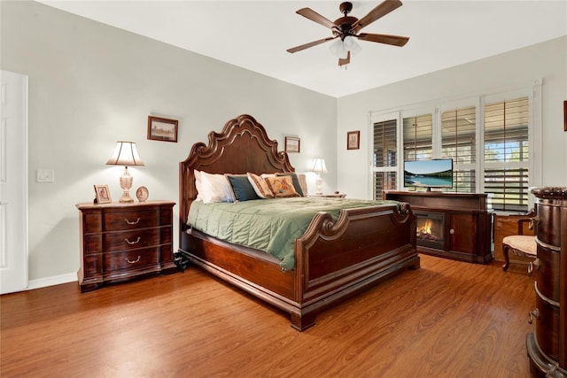 738 Powderhorn Cir, Lake Mary, FL 32746 - bedroom featuring baseboards, a ceiling fan, and wood finished floors